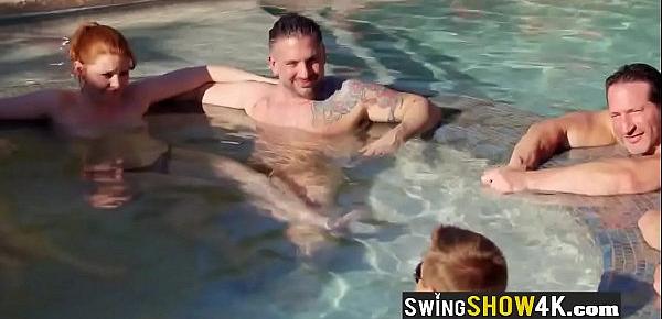  Newbie swinger couple is getting their clothes off during this pool party!